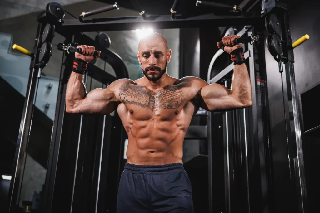 Fit Man With Muscles At Gym Working out